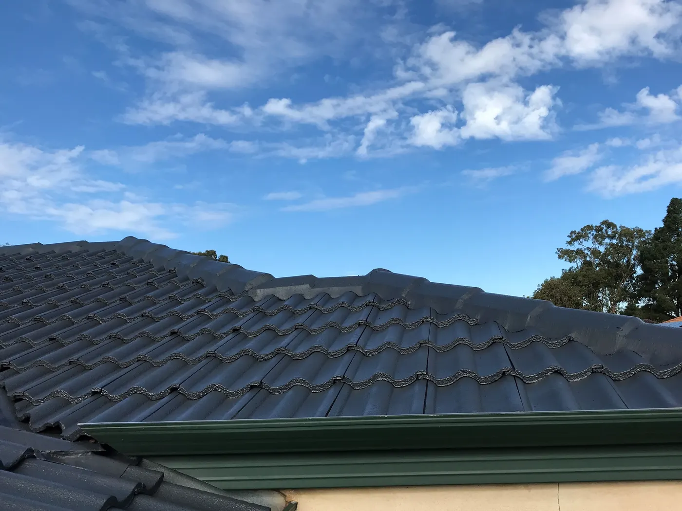 Same Perth roof after a Dulux Acratex restoration in Charcoal